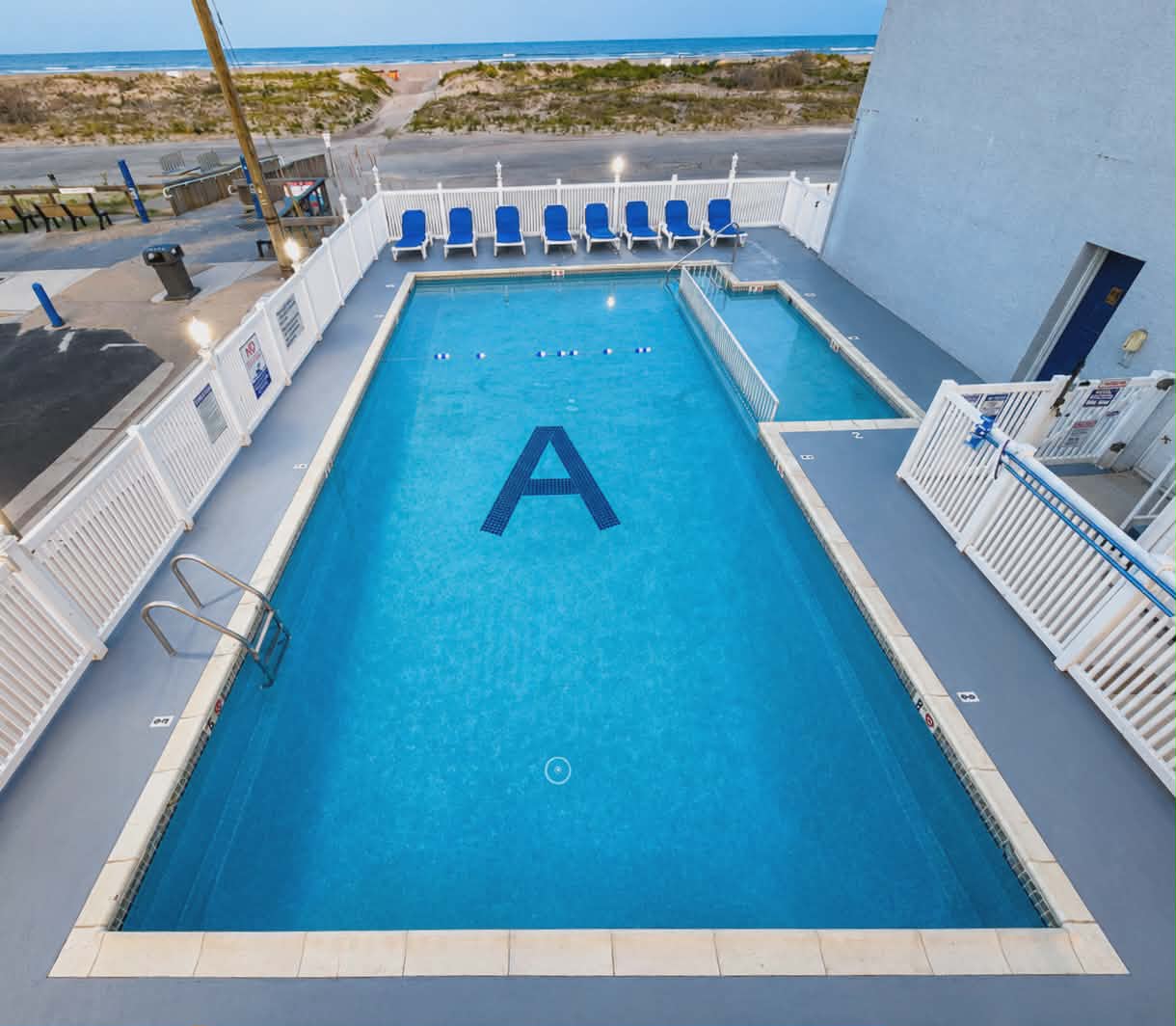 Acacia pool aerial at dusk